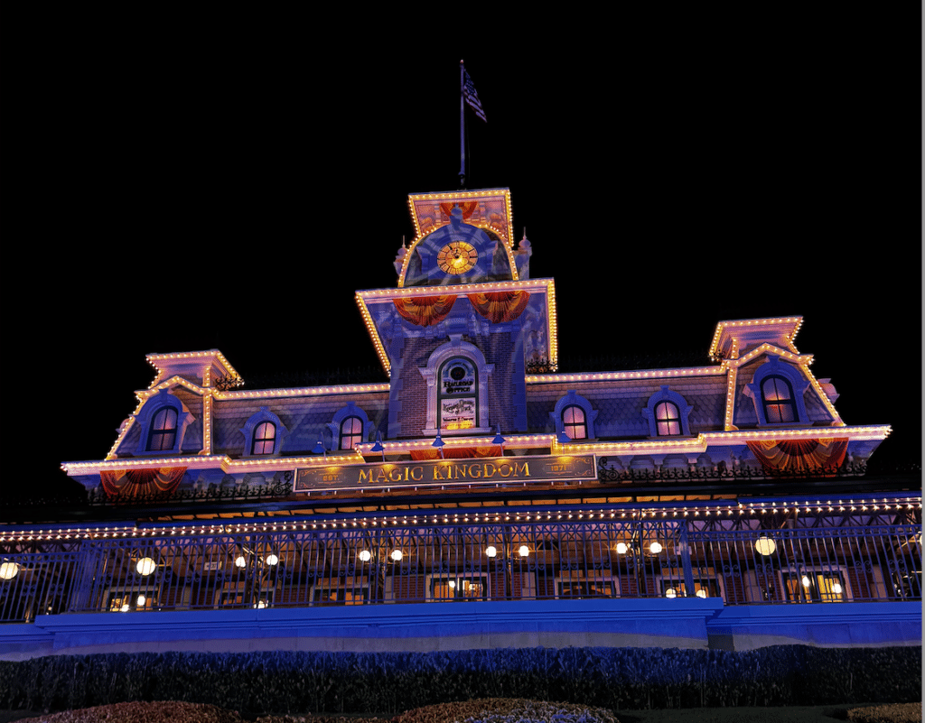 The Main Street Train Station at Magic Kingdom in Disney World, lit up for Mickey's Not-So-Scary Halloween Party